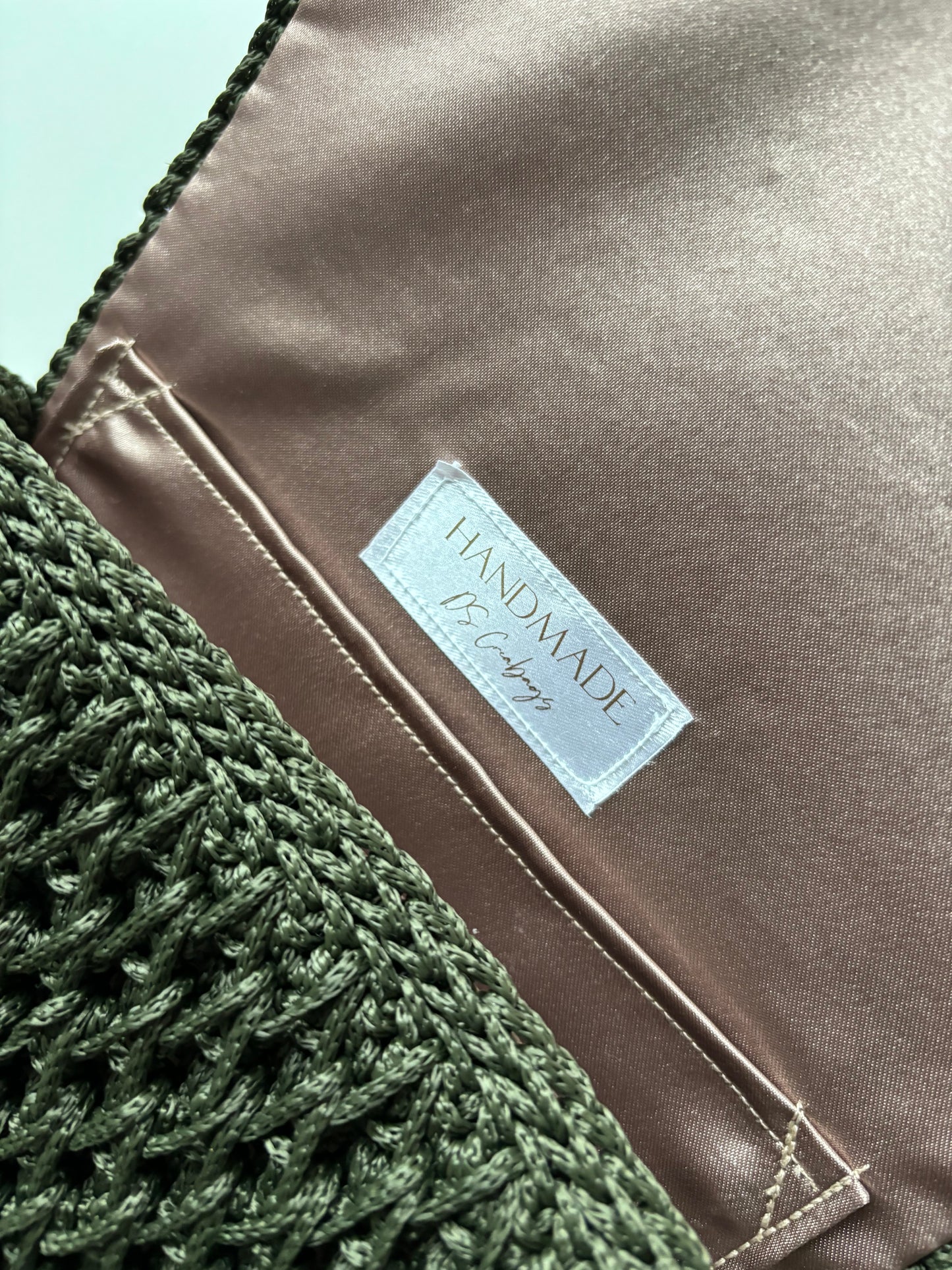 Mini handbag in dark green