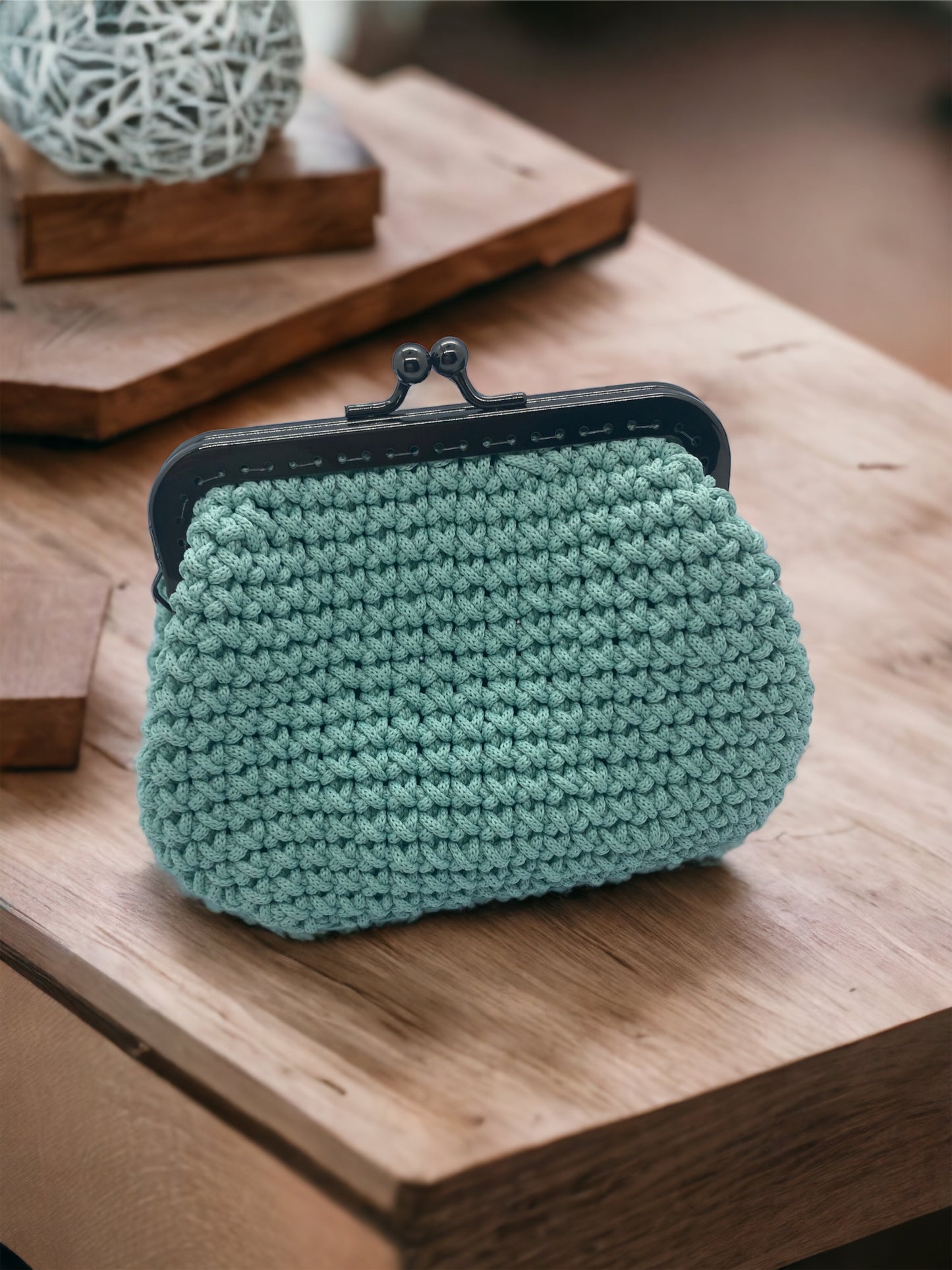 Make-up pouch with metal frame closure