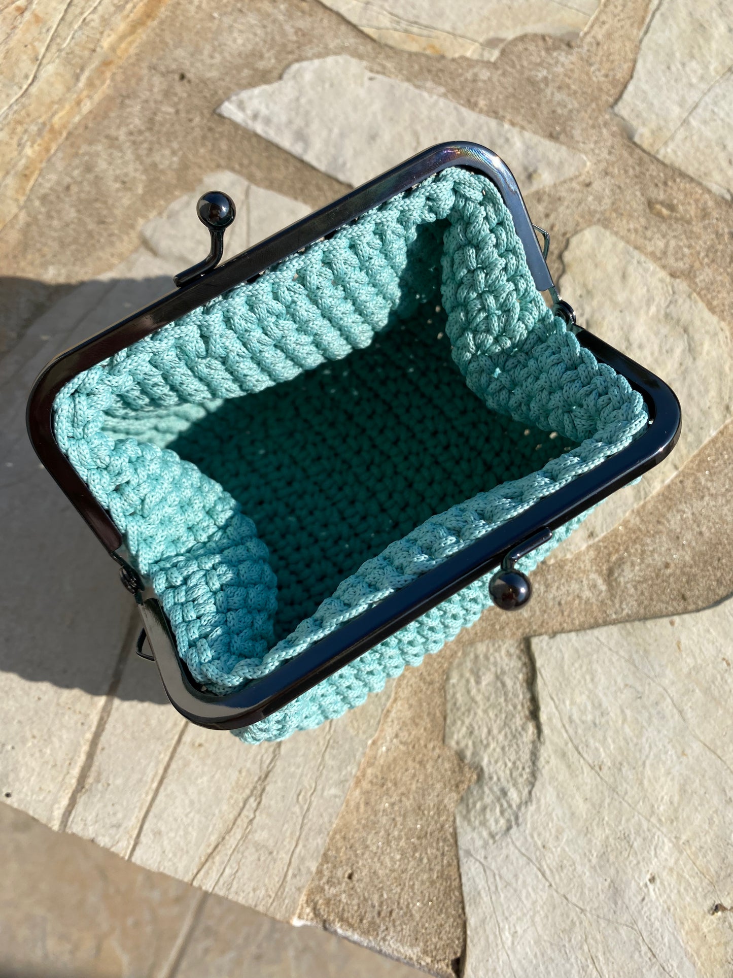 Make-up pouch with metal frame closure