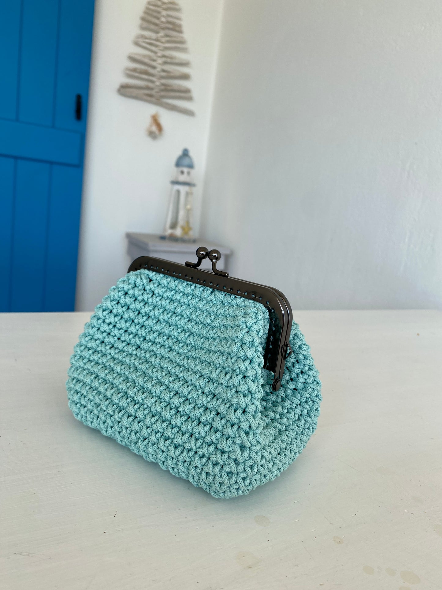 Make-up pouch with metal frame closure