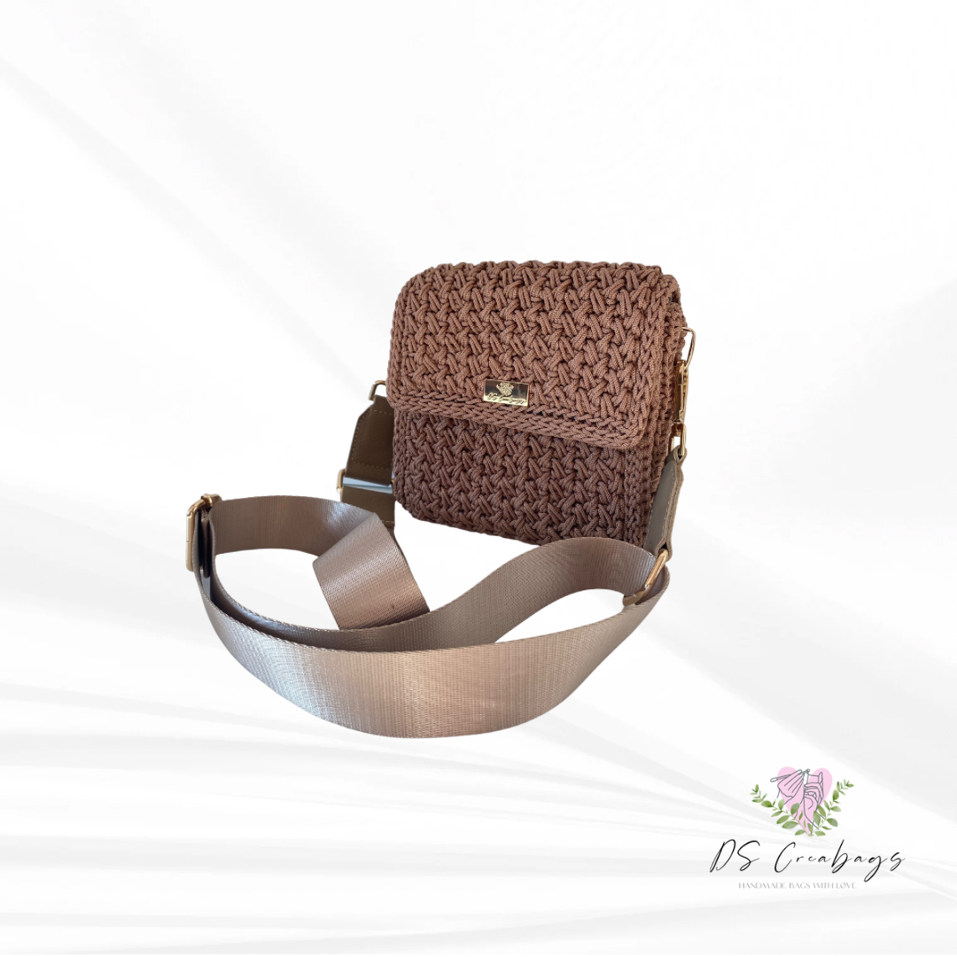 Chic mini crossbody features a relaxed fit and an adjustable long strap
